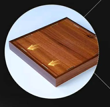 Close-up of the integrated walnut-finish base